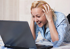 Woman-laughing-Laptop-Shutterstock