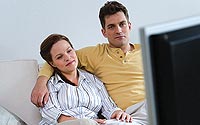 Man-Woman-atching-TV-A
